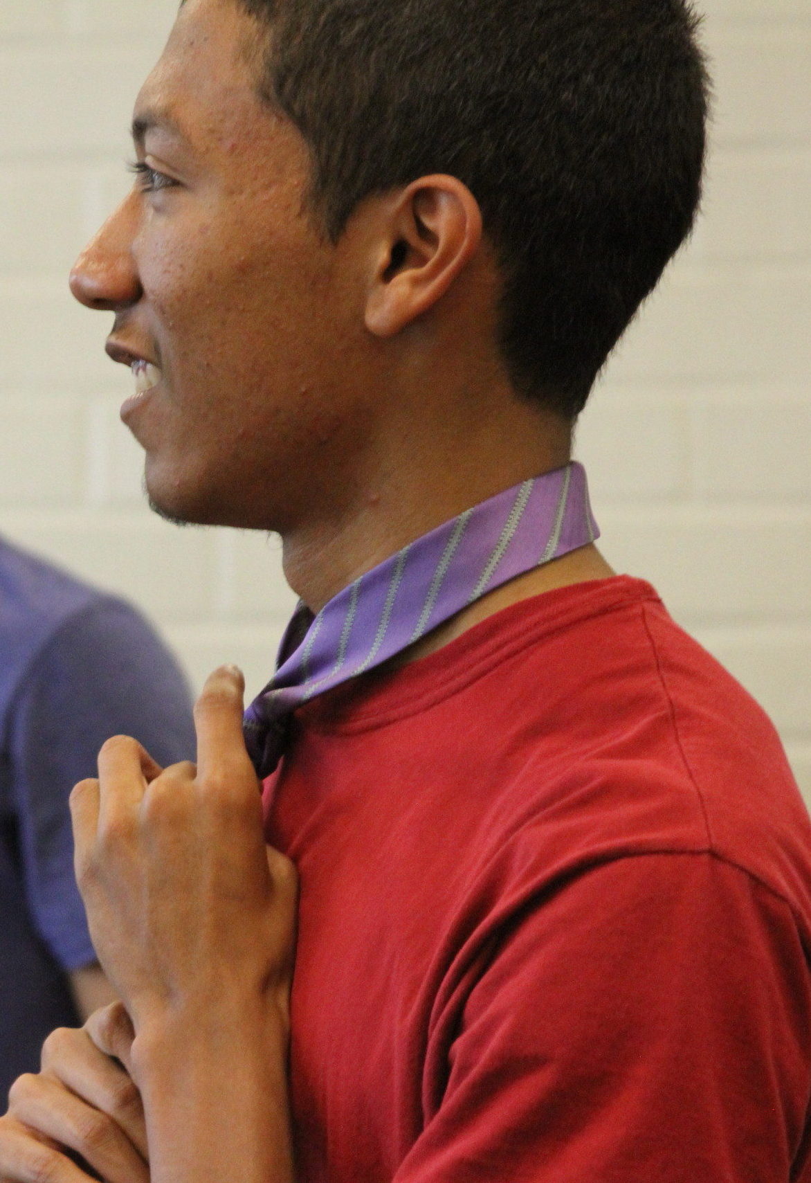 Young Man Tying a Tie