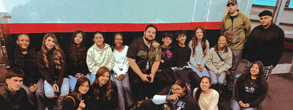 Multi ethnic youth group at ice skating rink