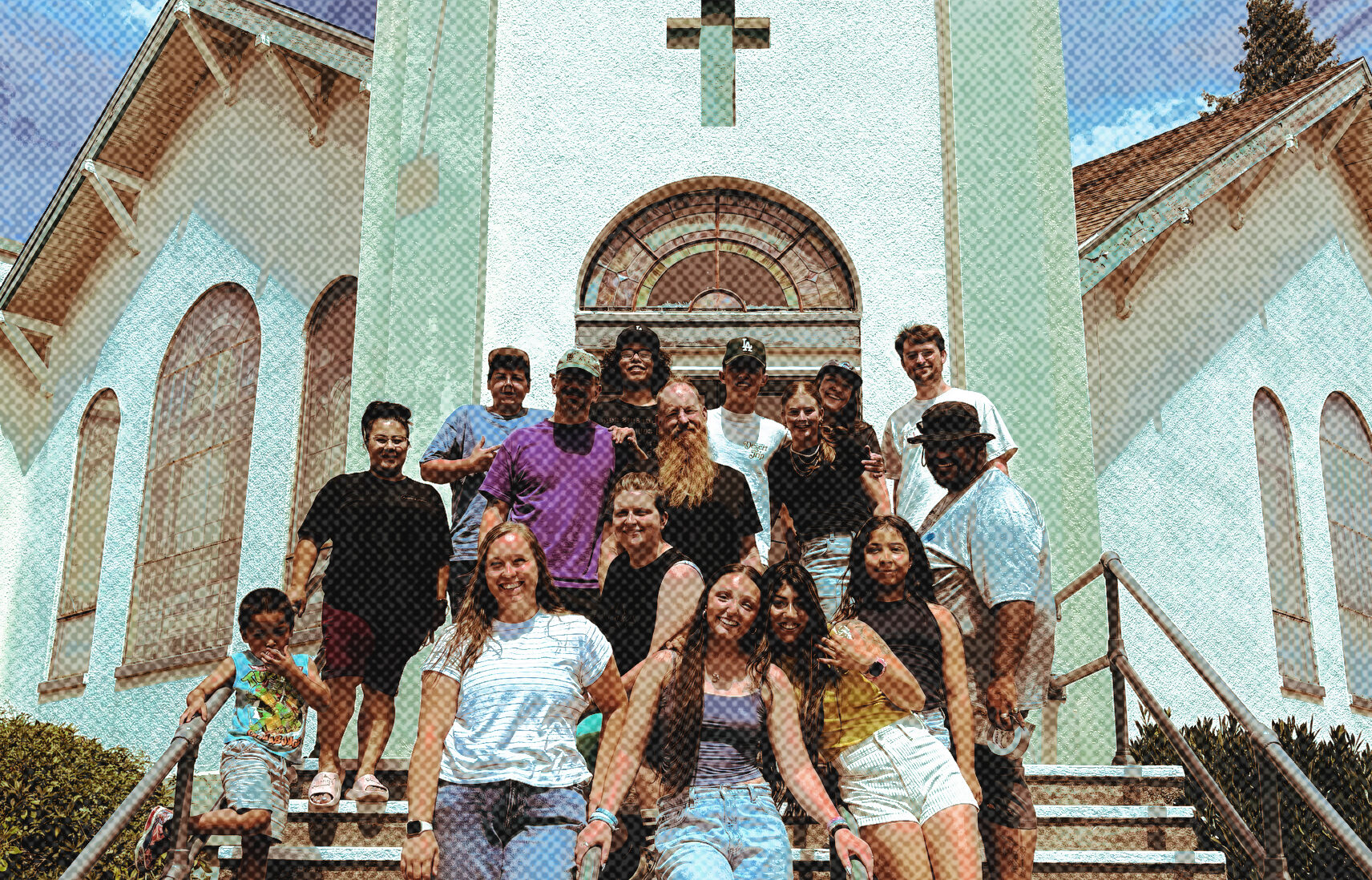 Youth group standing in front of church steps.
