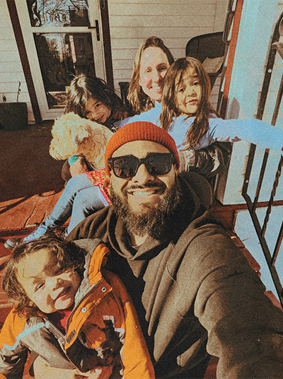Hispanic youth leader with family
