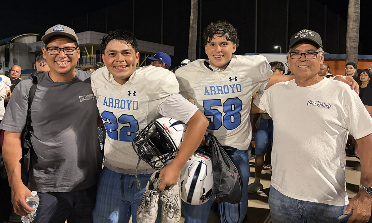 Youth pastor with students after football game, multi-generations