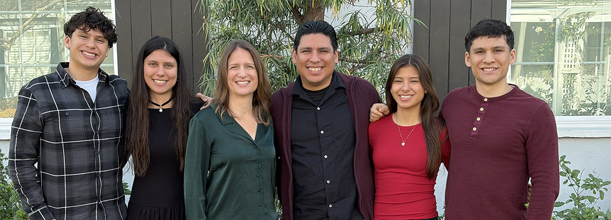 Hispanic family smiling at camera
